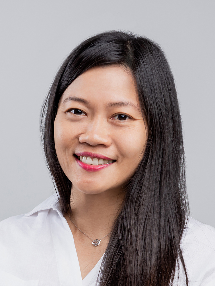 Lin Chin Mei smiling warmly, dressed professionally, representing a trusted EKAA trained clinical hypnotherapist specializing in inner child healing.